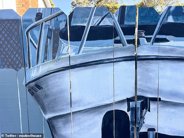 Seaside resident Etienne Constable was told he needed to put up a cover to hide the boat or face a $100 fine, so he created this fun optical illusion.