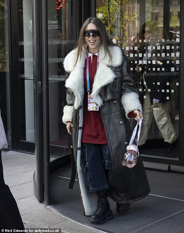 Italian actress Angelina Mango, 23, looked chic in oversized denim jeans, chunky black boots and a statement coat.