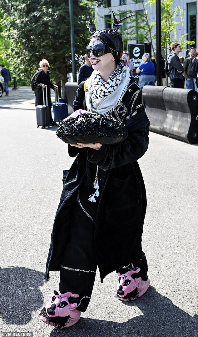 Bambie Thug, 31, who represents Ireland in the competition, cut a unique figure in pink sneaker shoes and special FX makeup.