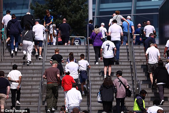 LONDON, ENGLAND - MAY 11: Tottenham Hotspur fans head to the stadium before the Premier League match between Tottenham Hotspur and Burnley FC at the Tottenham Hotspur Stadium on May 11, 2024 in London, England. (Photo by Bryn Lennon/Getty Images)