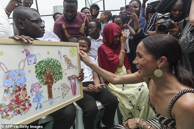 Team Sussex, a group of Harry and Meghan fans, came out in force as they cheered on the Duke and Duchess as they arrived just before midday.