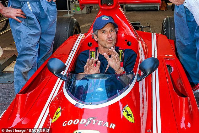 It was clear which team the stylish actor was on, as he was captured posing inside a stunning Ferrari racing car.