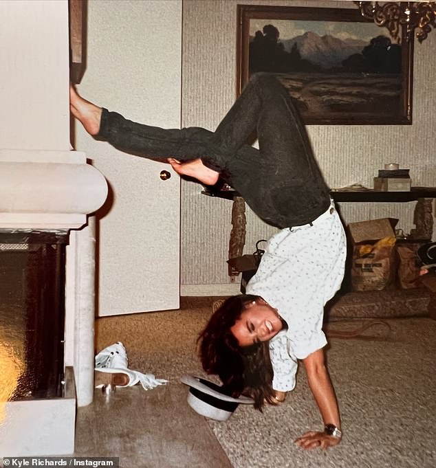 In a separate Instagram post, she shared a photo of herself at age 17 wearing a baggy white shirt with the sleeves rolled up and black pants doing a handstand.