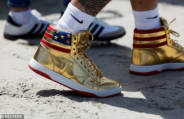 A man sports a pair of The Never Surrender high-top sneakers at Saturday's Trump rally in Wildwood, New Jersey.