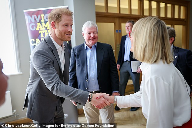 Prince Harry pictured meeting Louise Minchin at the Invictus Games event at Armory House on May 7.