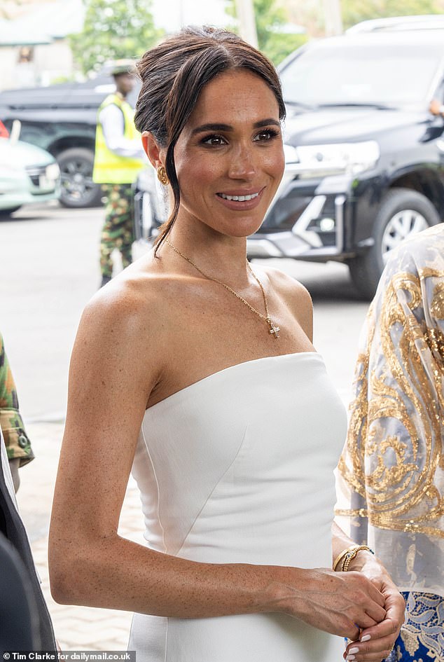 Meghan pictured during lunch with the Minister of Defense in Abuja, Nigeria, on May 11.