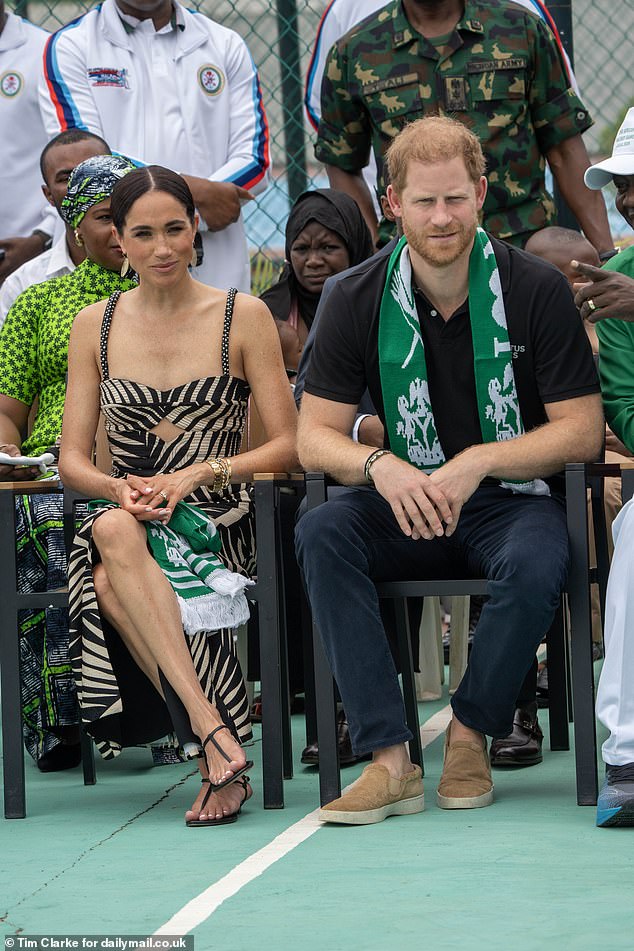 Prince Harry and Meghan Markle photographed at an exhibition volleyball match on May 11 in Abuja, Nigeria.