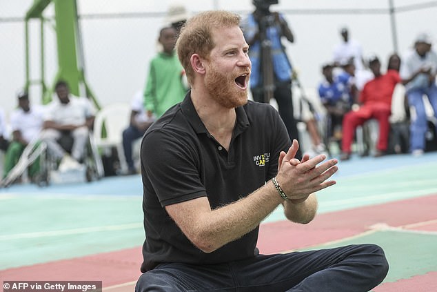 Prince Harry tries his hand at playing sitting volleyball with injured army veterans