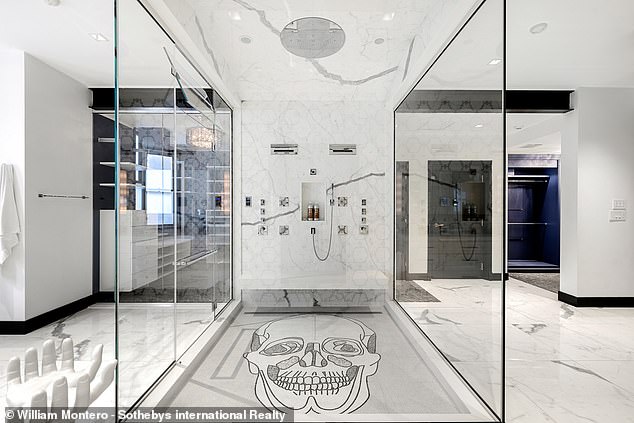 A terrifying skull is seen in the white marble bathroom of the luxurious house.