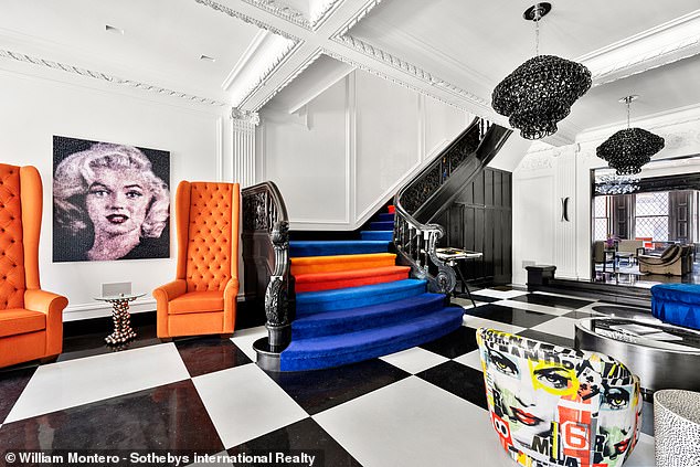 Bold and bold artwork dominates the home's walls and chairs.