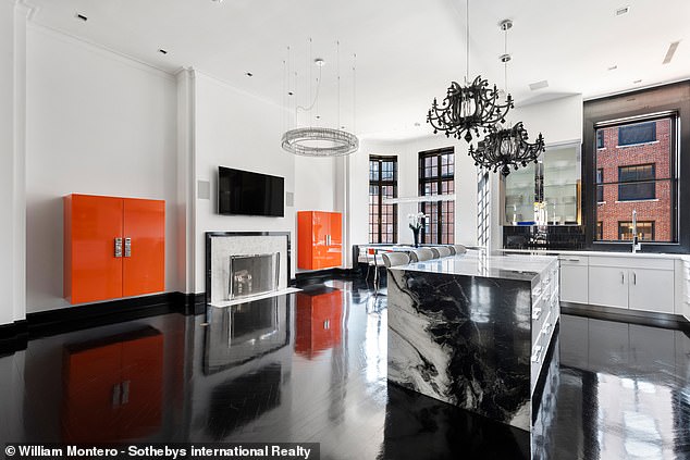 Bright orange cabinet gives bold blocks of color in solidly built kitchen