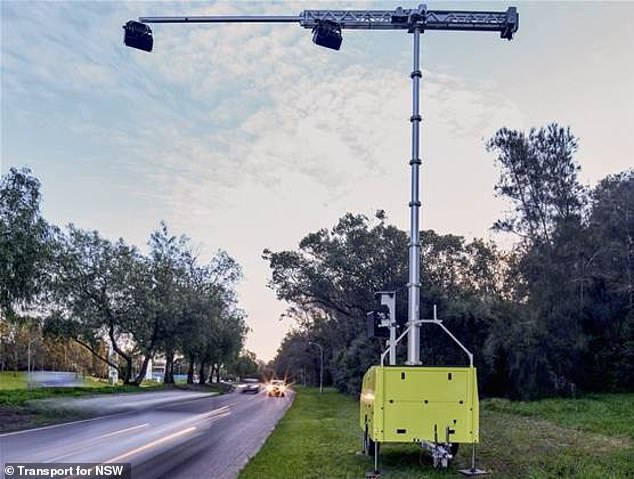 NSW Transport doesn't want warning signs because it wants drivers to do the right thing and not use their phones. They are more likely to do this if they think they could be caught at any moment. (pictured, a stock image of a portable mobile phone detection camera)