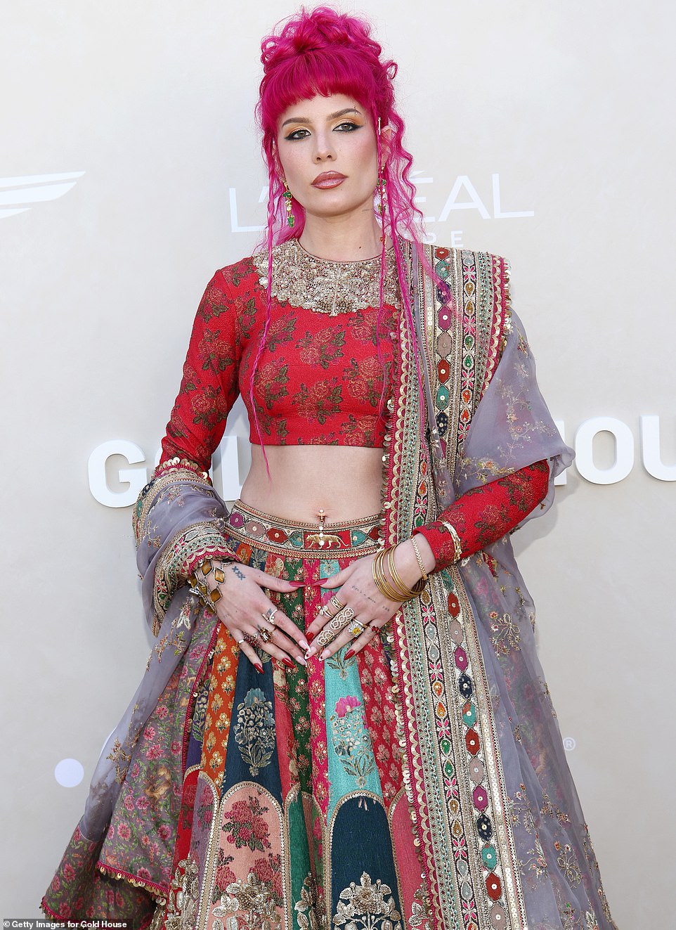 Halsey was a stunning presence on the red carpet in a boldly designed lehenga, paired with a stunning cotton candy hairstyle that complemented the lush colors of her outfit.