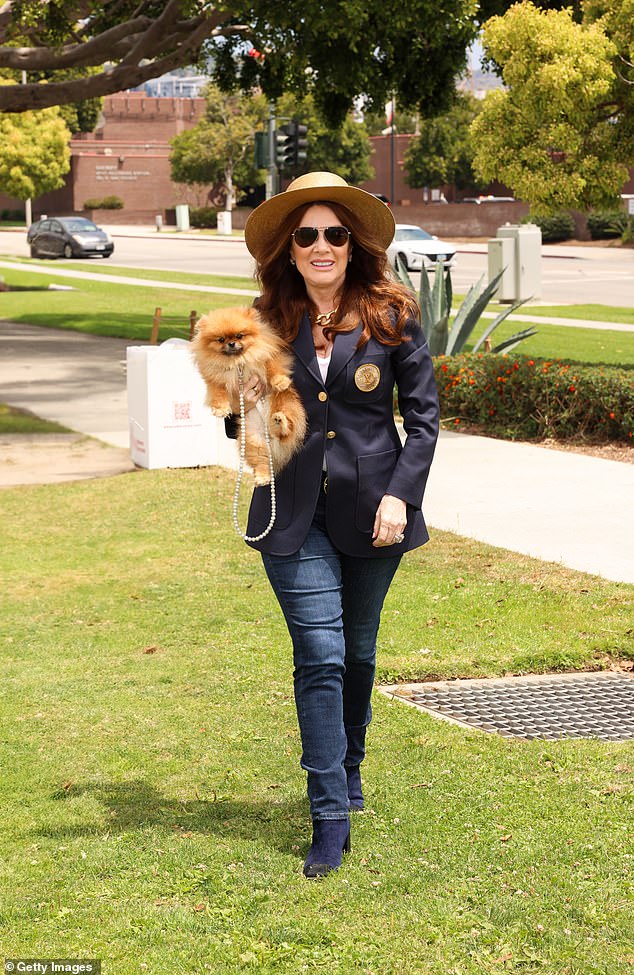 The reality TV star brought her pup along in some sweet photos as she showed off her outfit.