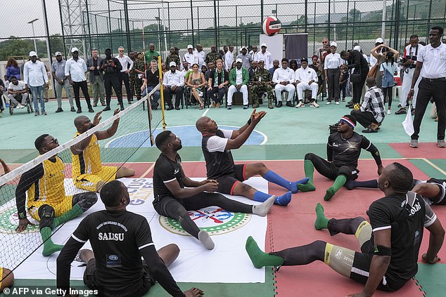 On the left you can see members of the Nigeria Unconquered team, dressed in yellow, while the players of the Chief of Defense Staff's team are dressed in black.