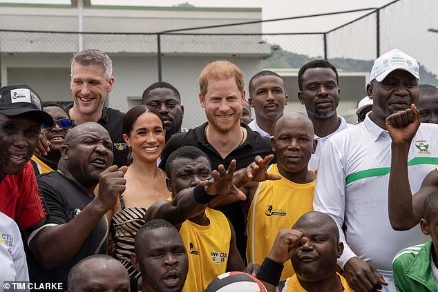 Many of the players, including men and women, were amputees and Meghan clapped and cheered as Harry and his team. In the photo: Harry and Meghan pose with their hosts.