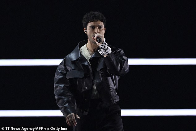 Swedish singer Eric Saade, one of three former contestants who opened the contest in Malmo, tied the scarf around his wrist, which has become a symbol of support for Palestine amid the conflict in the Middle East.