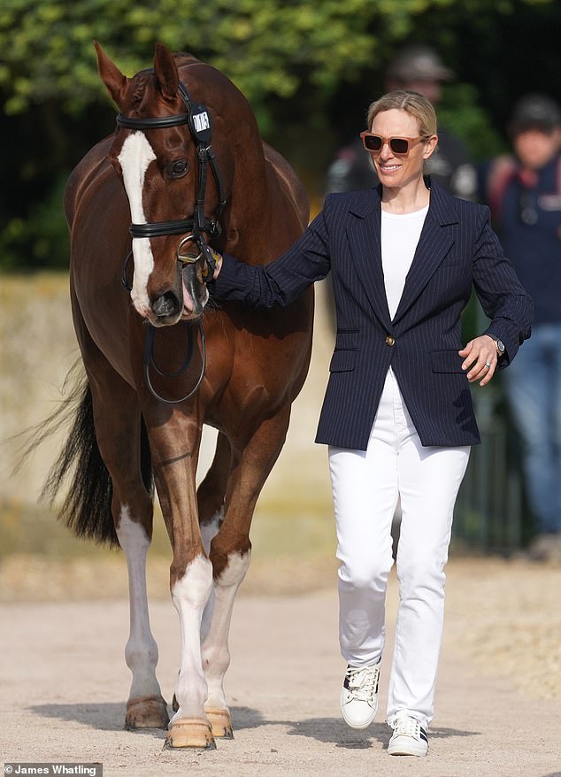 Princess Anne's daughter, who is also an Olympic silver medalist, looked barely breathless as she took her gelding, Class Affair, for an inspection.