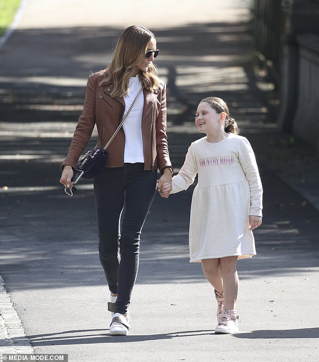 She finished her look with a pair of white sneakers and a Dolce & Gabbana crossbody bag.