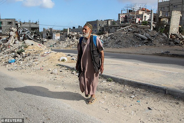 A Palestinian flees Rafah after Israeli forces launched a ground and air operation in the eastern part of the southern Gaza city.