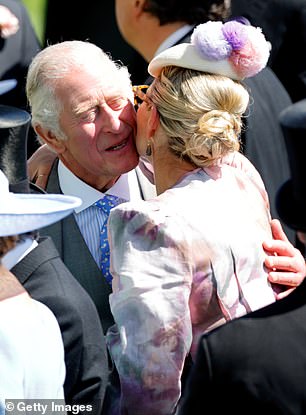 Zara greets her uncle by hugging him and kissing his cheek.