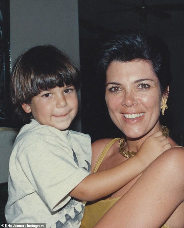 Jenner shared a throwback image of her son Rob in her arms