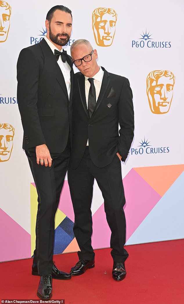 The clean-shaven TV personality appeared in high spirits as he confidently posed alongside Rob at London's Royal Festival Hall.