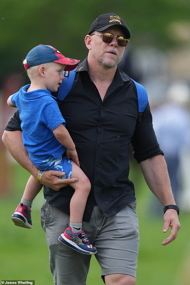 Lucas Tindall (left) with Zara's husband Mike Tindall (right) as they attend the event.