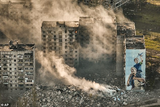 Putin understands that the West will give Ukraine enough weapons to keep it at bay, but never enough to push its troops back across the border. Pictured: Destroyed buildings in Bakhmut, Ukraine.