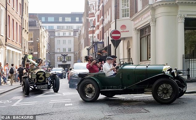 The Aquaman star sat in the left passenger seat while one colleague drove the Bentley while another recorded video with a camera.