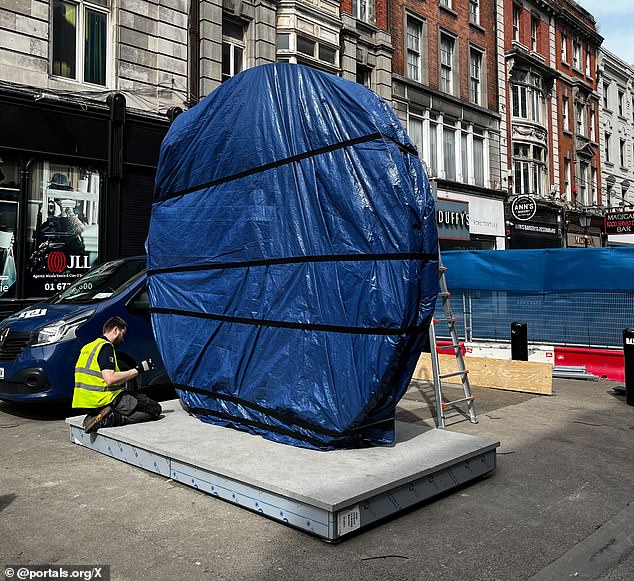 The Portal was first created in 2021 by Lithuanian artist Benediktas Gylys, who also primarily funded it. Pictured: The Dublin portal ahead of its unveiling today.