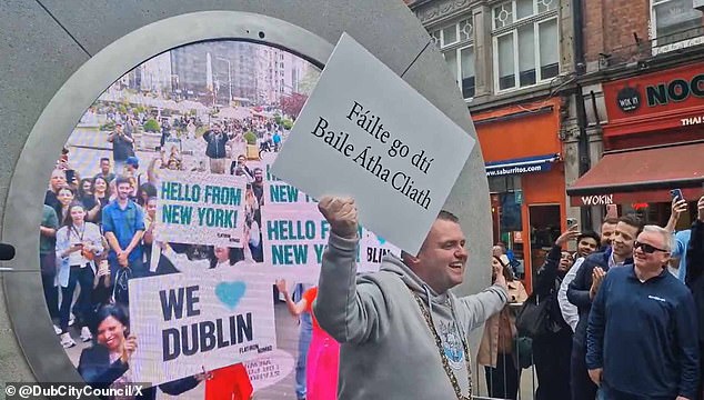 Dublin Mayor Daithí De Róiste launched the portal in Dublin (pictured), showing people in New York City.