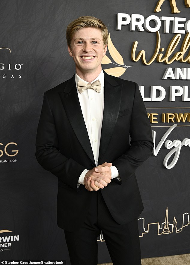 Robert looked really dapper in a classic tuxedo paired with an elegant bow tie.