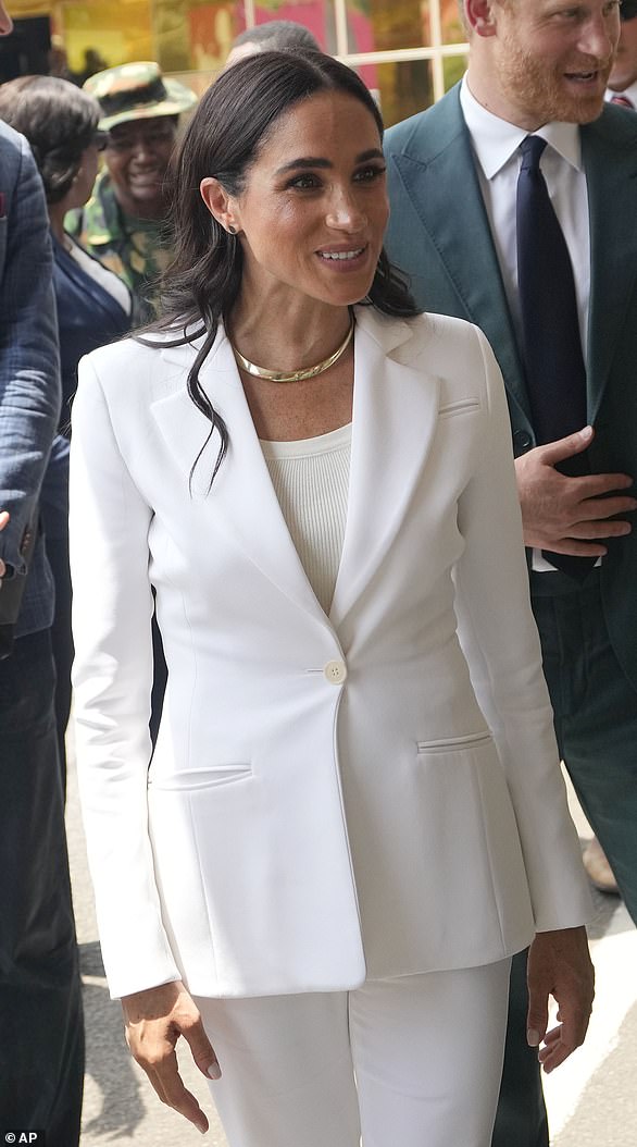 Later that day, Meghan donned an Altuzarra suit to visit army wives at Defense Headquarters in Abuja.