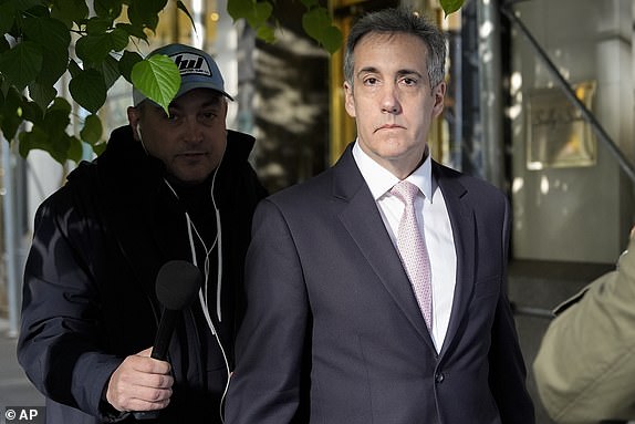 Michael Cohen leaves his apartment building on his way to Manhattan Criminal Court, Monday, May 13, 2024, in New York. (AP Photo/Julia Nikhinson)