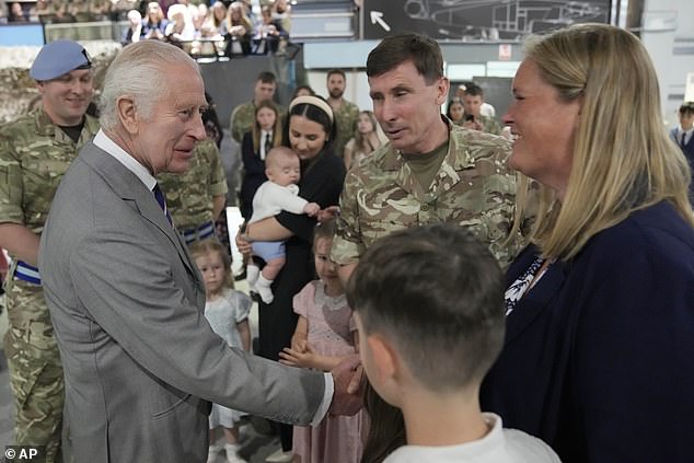 King Charles III meets staff members and their families at the Army Aviation Center today