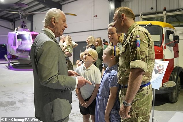 King Charles III meets staff members and their families at the Army Aviation Center today