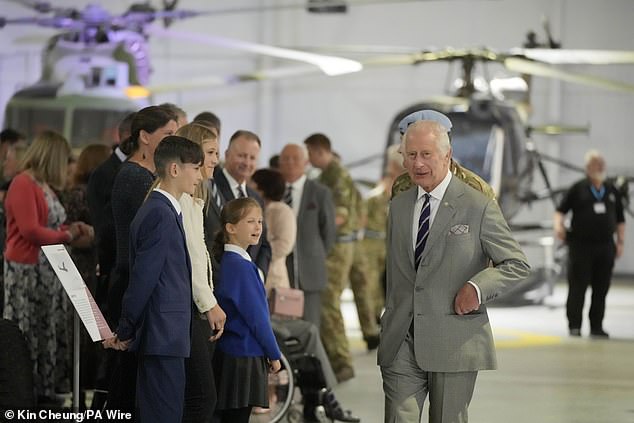 King Charles III meets staff members and their families at the Army Aviation Center today