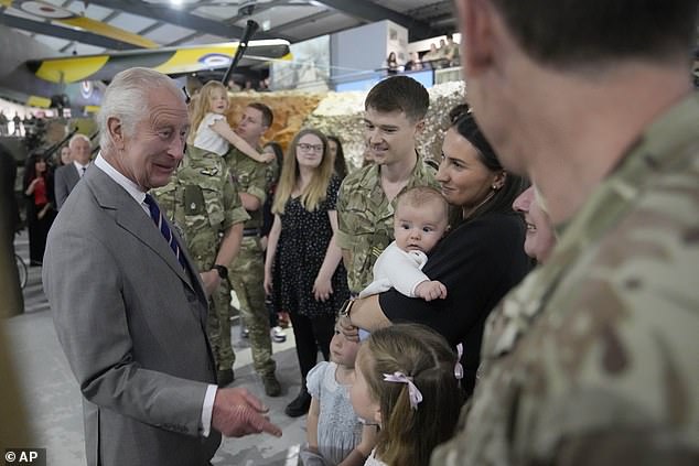 King Charles III meets staff members and their families at the Army Aviation Center today