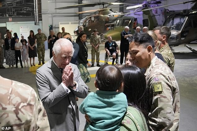 King Charles III meets staff members and their families at the Army Aviation Center today