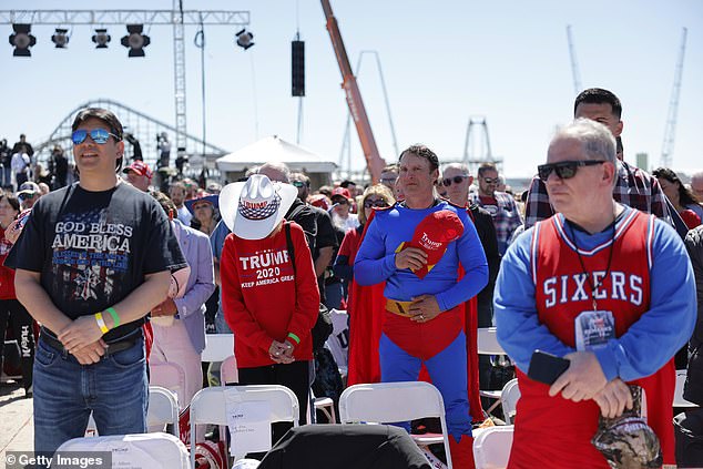 Supporters of former President Donald Trump listen to the national anthem before Saturday's rally in Wildwood, New Jersey. Trump is about to pick a running mate, and his supporters say they like Gov. Ron DeSantis, Sen. JD Vance, Vivek Ramaswamy and others.