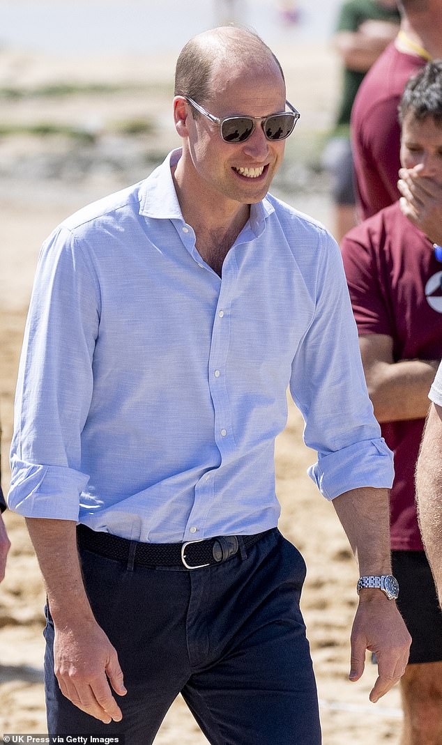 William looked relaxed in a light blue shirt and navy chinos. He added a pair of stylish sunglasses for the relaxed outing.