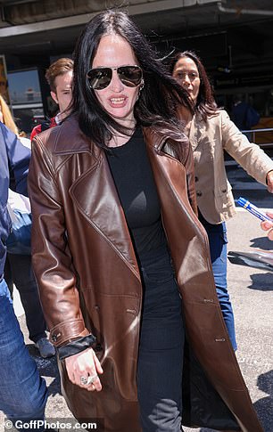 The French actress showed her teeth when she began to be flanked by fans and one of them tried to hand her a pen to sign an autograph.