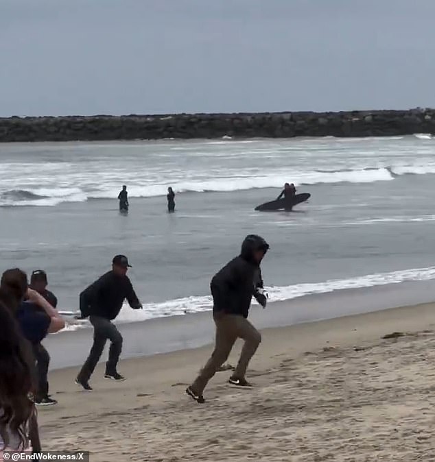 The migrants ran off the ship and headed to a residential street.