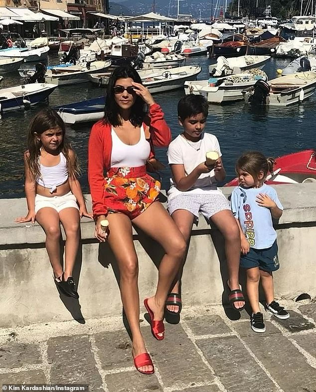 Kardashian posted a photo showing Kourtney sitting with her eldest son Mason, 14, daughter Penelope, 11, and second child Reign, nine.