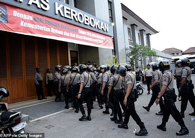 Pictured: Police outside Kerobokan Correctional Facility, where Troy Smith could be sent.