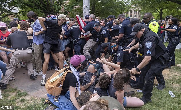 Pro-Palestinian protesters clash with police after replacing an American flag with a Palestinian flag on April 30 at UNC.