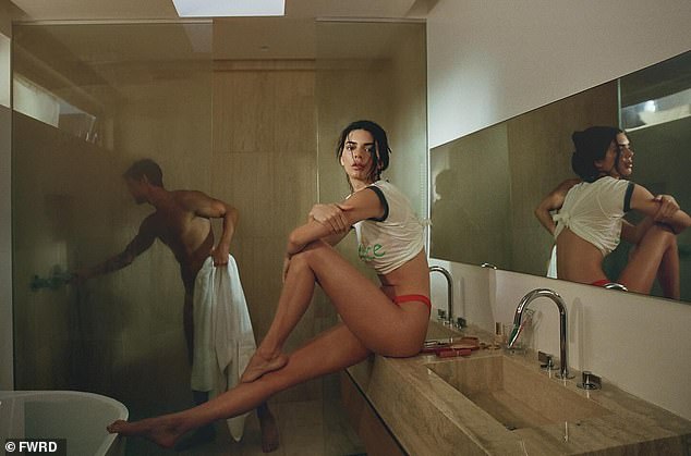 Among the steamy shots was one of Kendall sitting on the bathroom counter while a seemingly naked man took a shower.