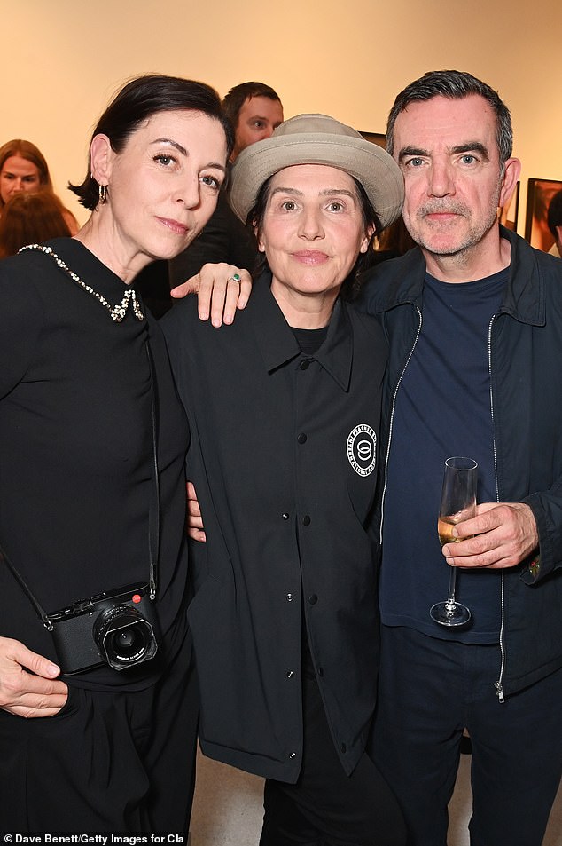 Mary poses with her husband Simon Aboud, 58, and Sharleen, 56.