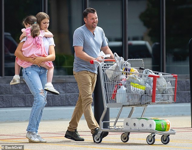 The happy family headed to the local supermarket after attending church.